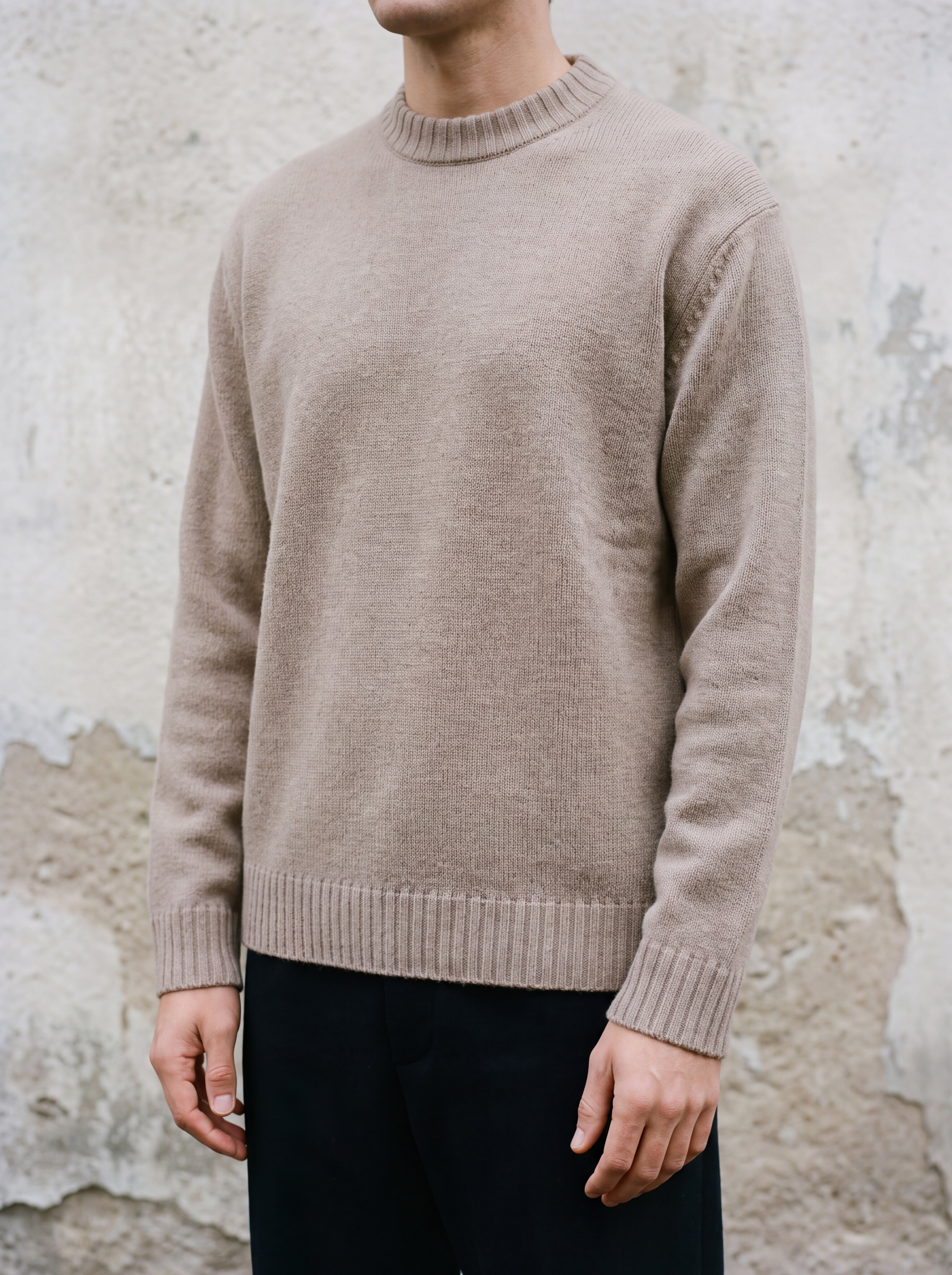 Francesco Bellani knitwear — Navigli wool pullover worn against weathered stucco