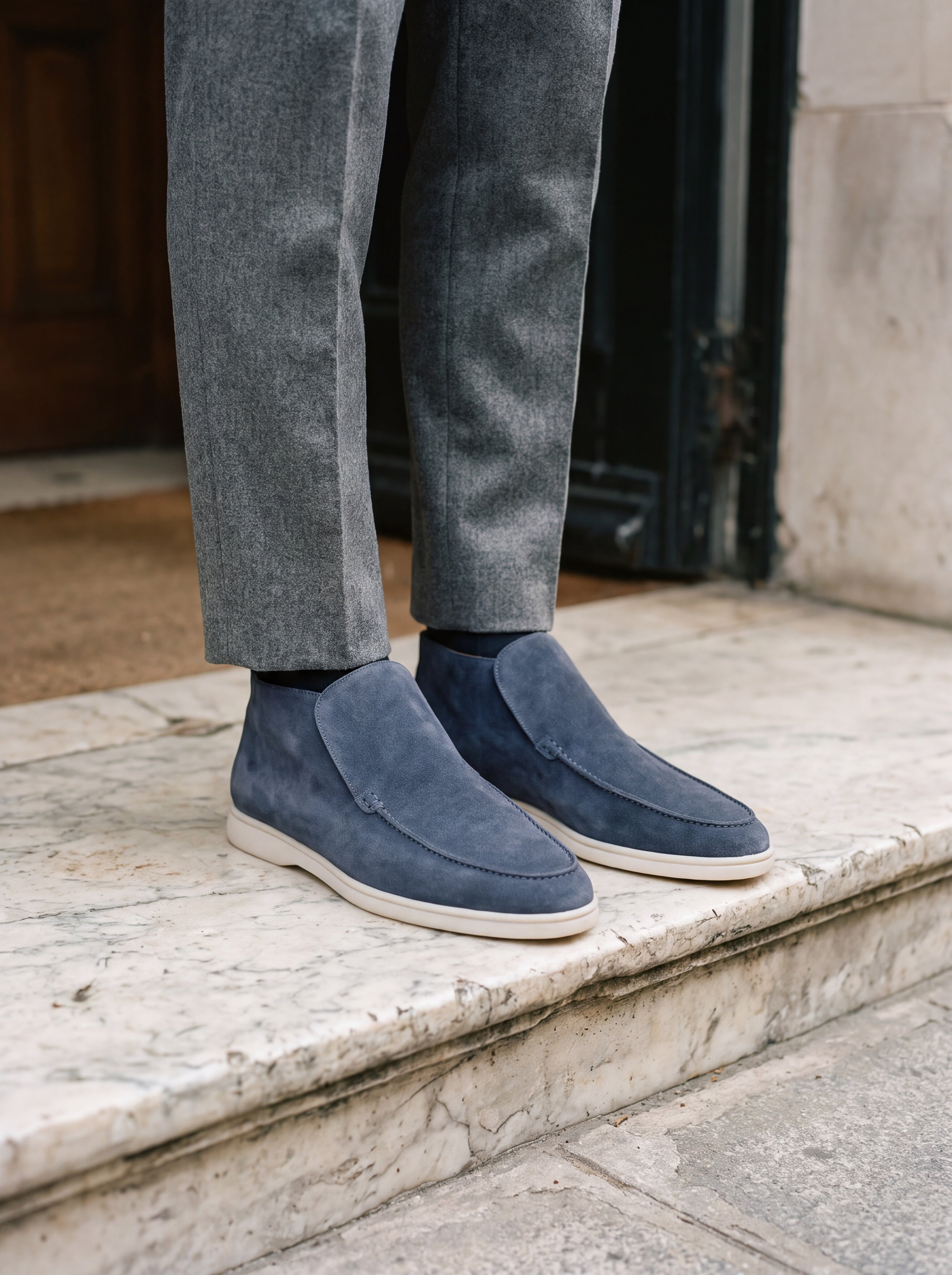Francesco Bellani Varenna high loafers worn with tailored wool trousers on an aged marble threshold