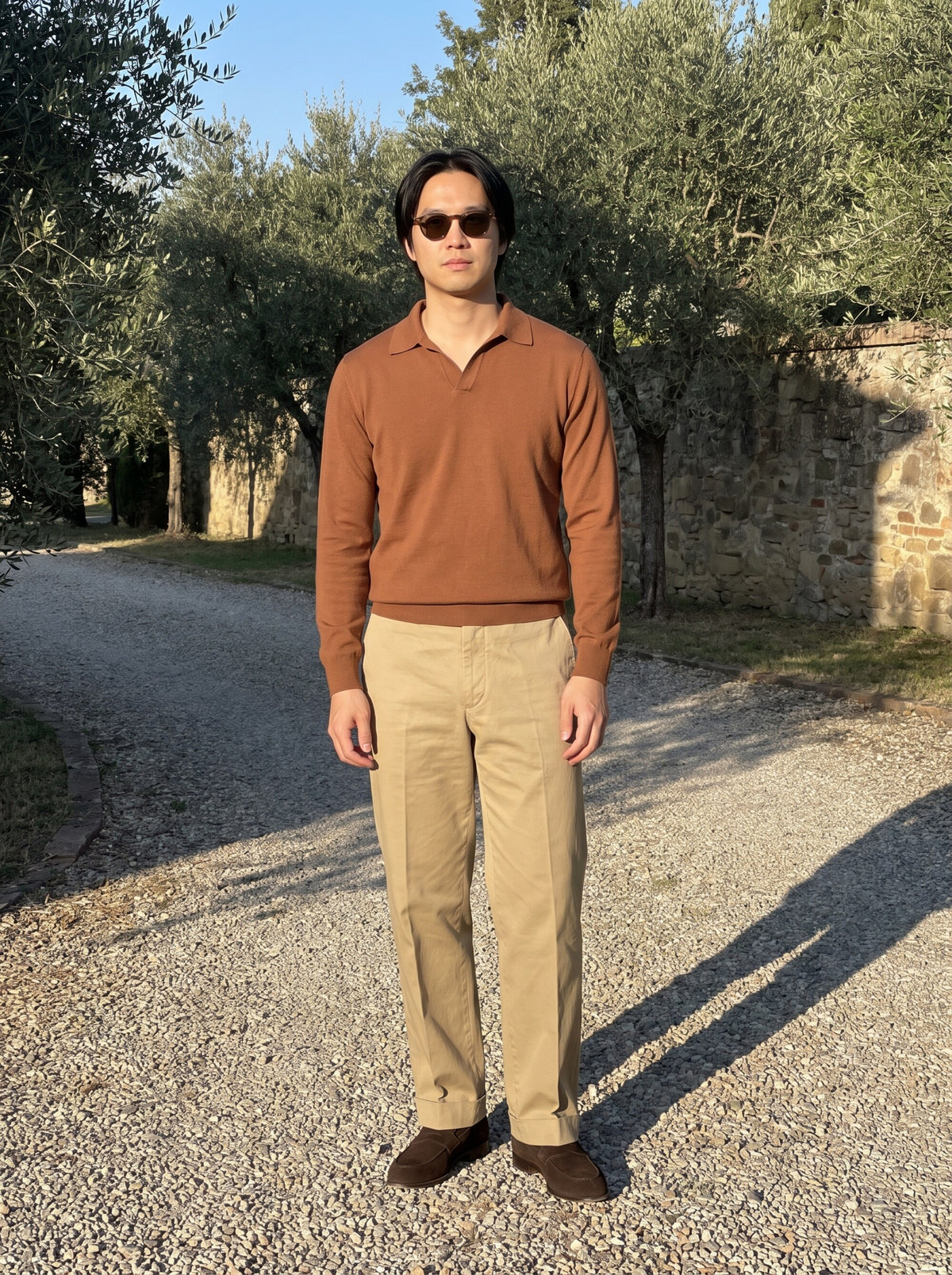 Cinnamon knitted polo, khaki trousers and ebony brown suede high loafers