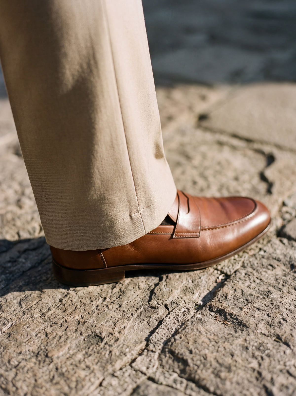 Close detail of the Francesco Bellani Camogli trouser hem breaking cleanly over a leather loafer