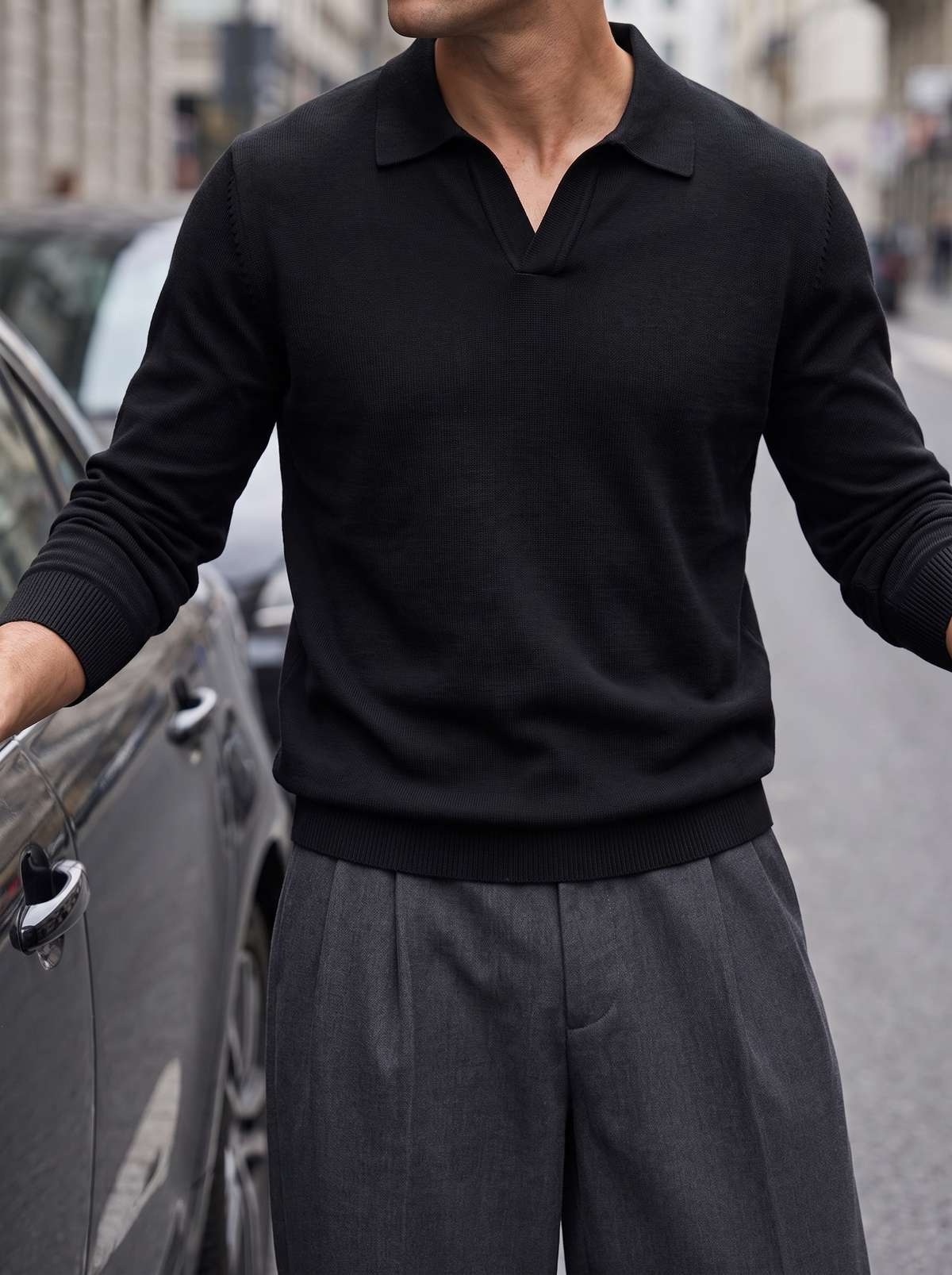 Shallow V collar detail on a midnight black knitted polo — Francesco Bellani Solferino